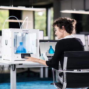 woman using Ultimaker S3 in printing lab